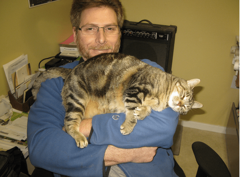 man holding a kitty