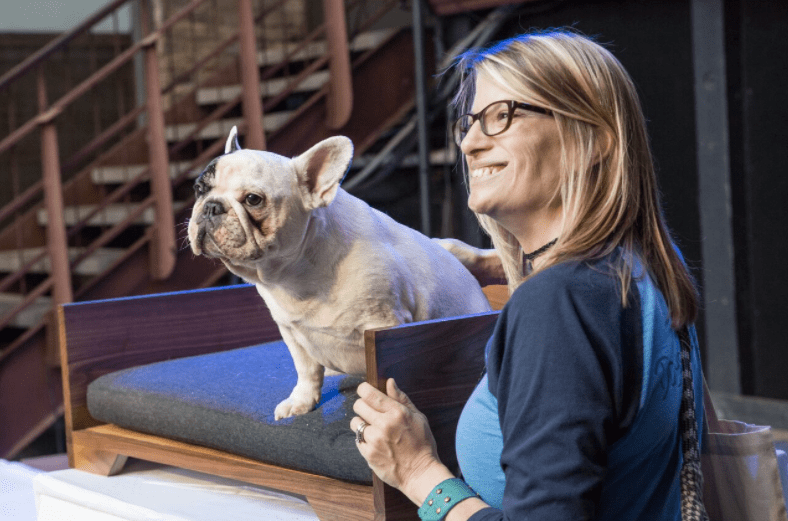 woman posing with a dog