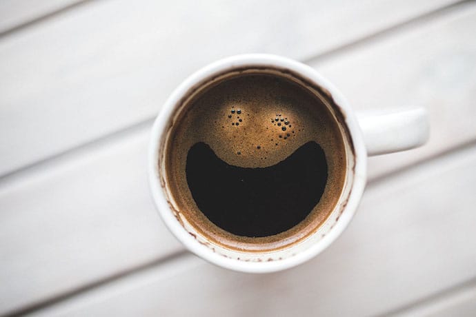 a cup of coffee with a smile