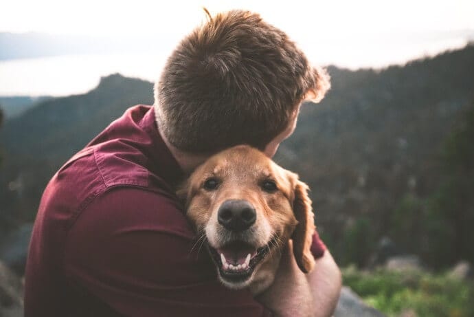 A man and a dog on a walk