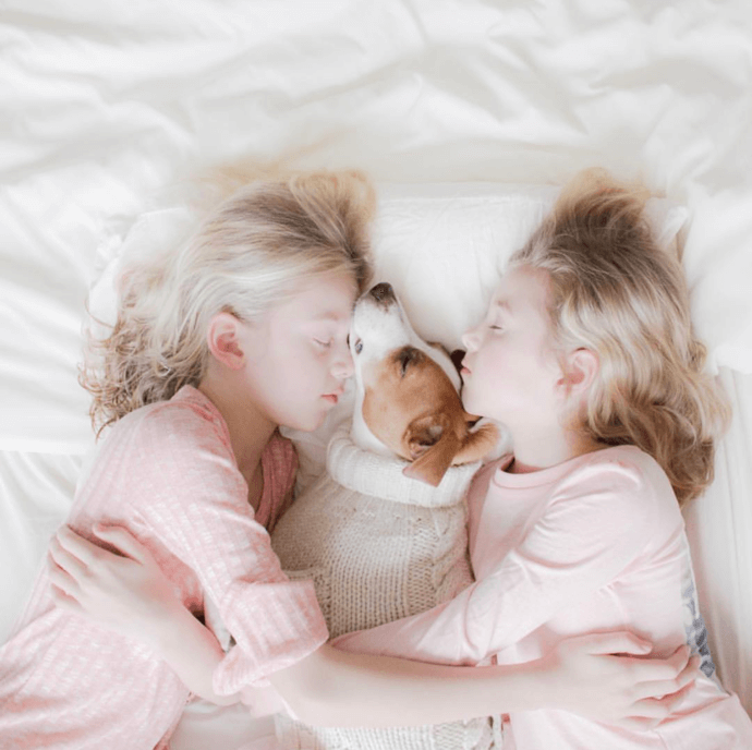 two girls with a dog